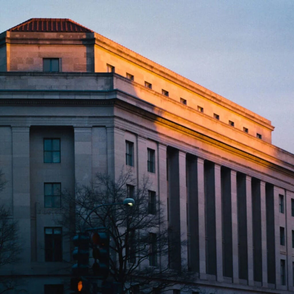 A government building at sunset.