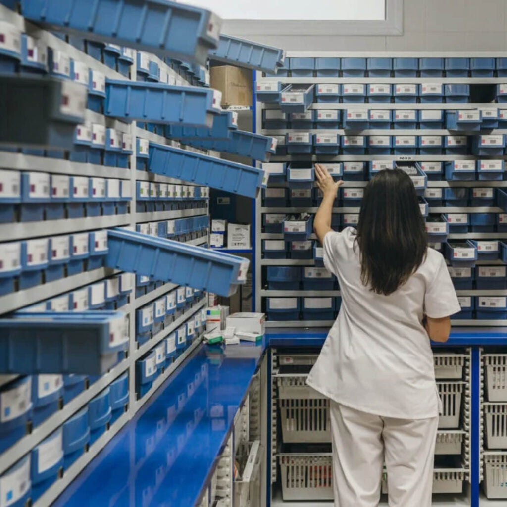 Healthcare professional in a storage room.